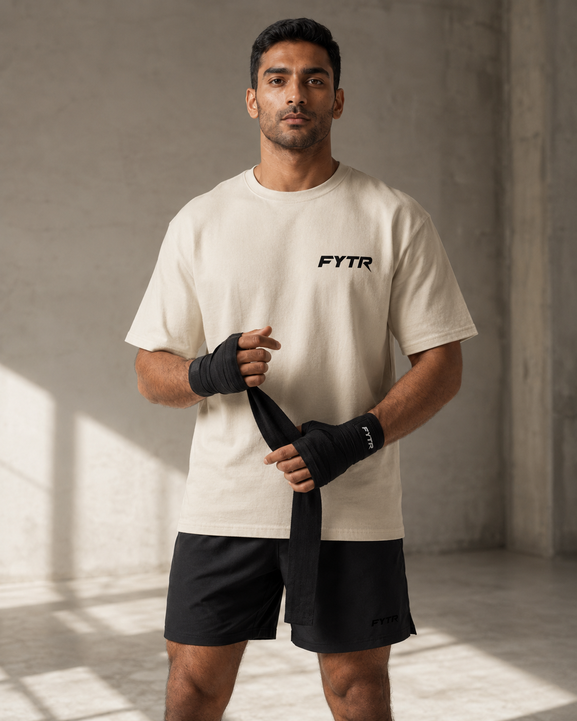 Model wearing the FYTR Core T-Shirt in Natural in a boxing stance