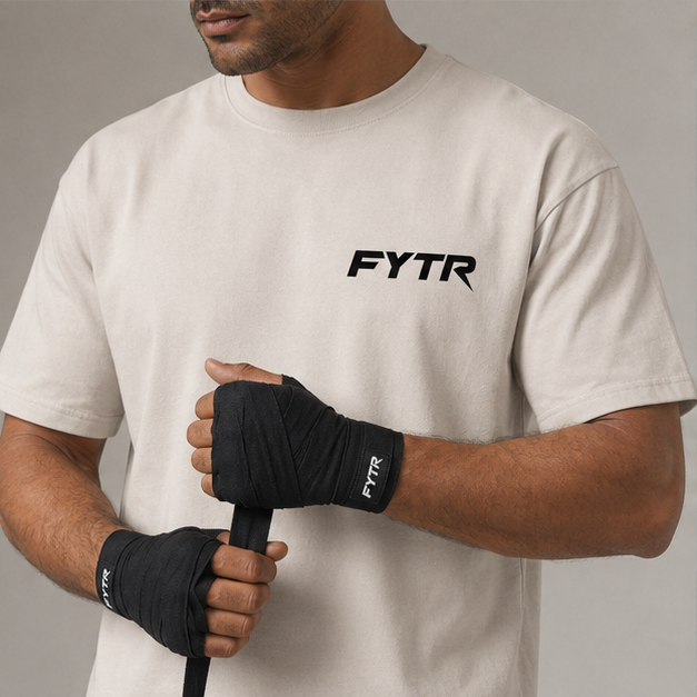 FYTR chest logo and branded hand-wrap detail on the Natural Core T-Shirt