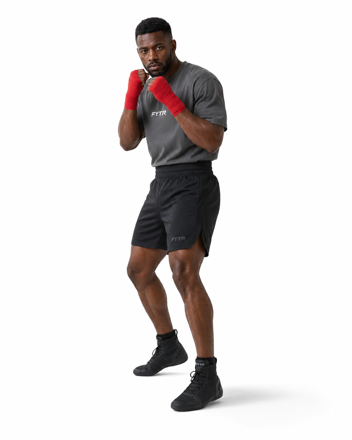 FYTR athlete holding a high guard on a white studio background in the Charcoal Core Training T-Shirt and red hand wraps