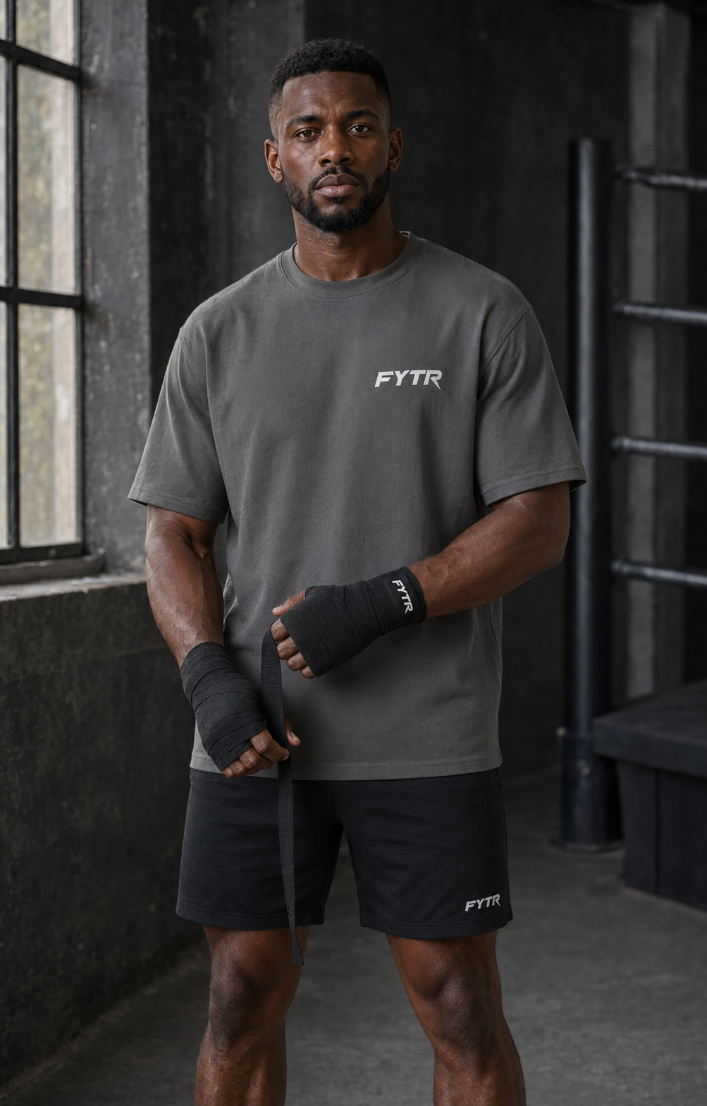 Model wearing the FYTR Core T-Shirt in Charcoal in a boxing stance