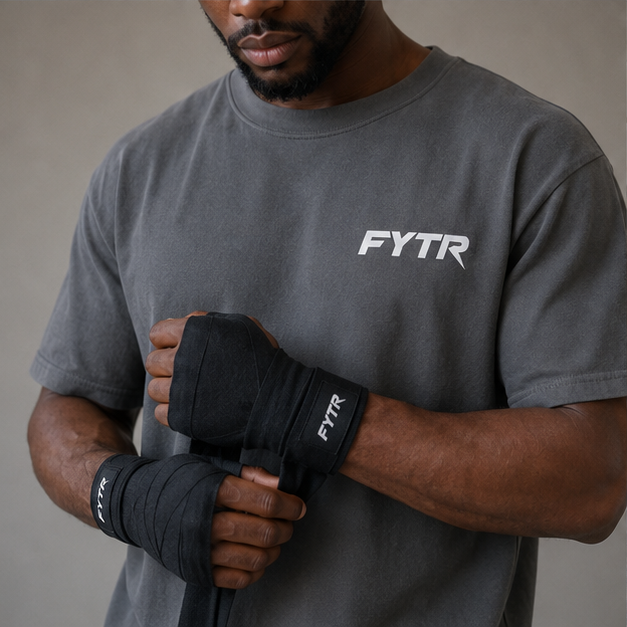 FYTR chest logo and branded hand-wrap detail on the Charcoal Core T-Shirt
