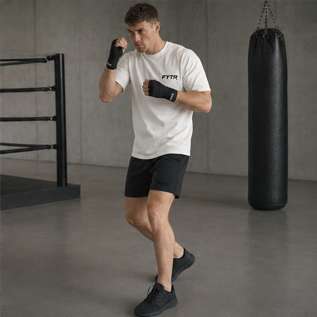 Model moving in the FYTR Core T-Shirt in Off White