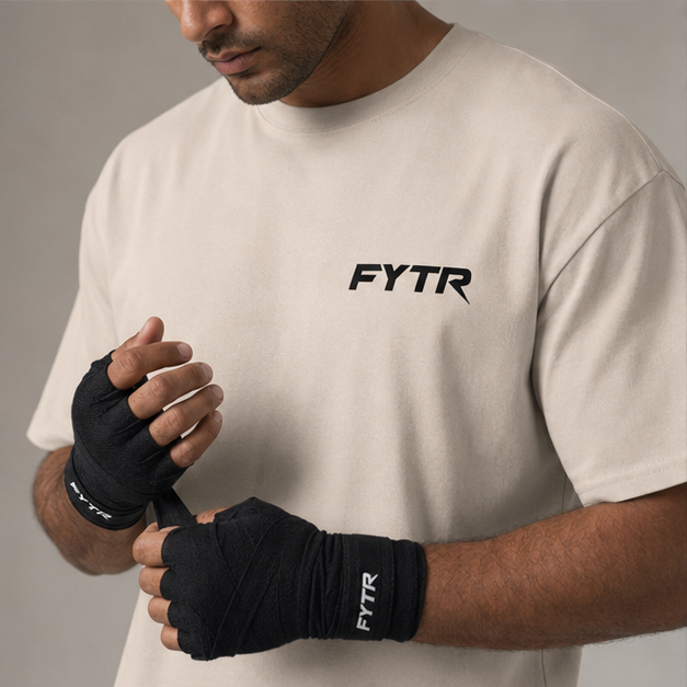 FYTR chest logo and branded hand-wrap detail on the Sand Core T-Shirt