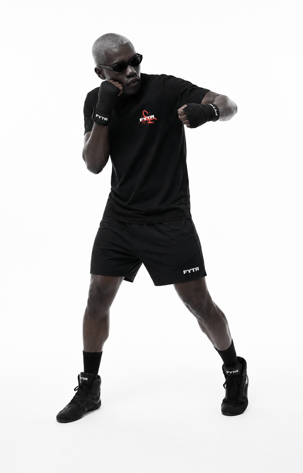 Model moving in the FYTR Scorpion Graphic T-Shirt in Vintage Black