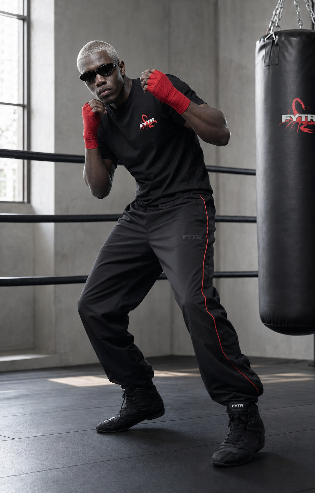 FYTR Scorpion character weaving in the Vintage Black Back-Print T-Shirt and red hand wraps